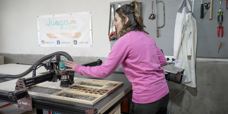 The Red Fox CNC milling machine in action in Sara's workshop, cutting wood with precision